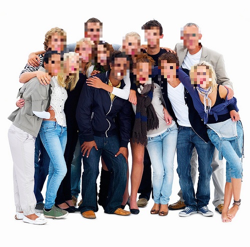 Group of people where all faces have been automatically pixelated.