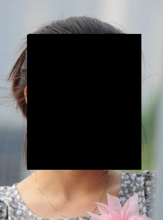 Face blacked out.